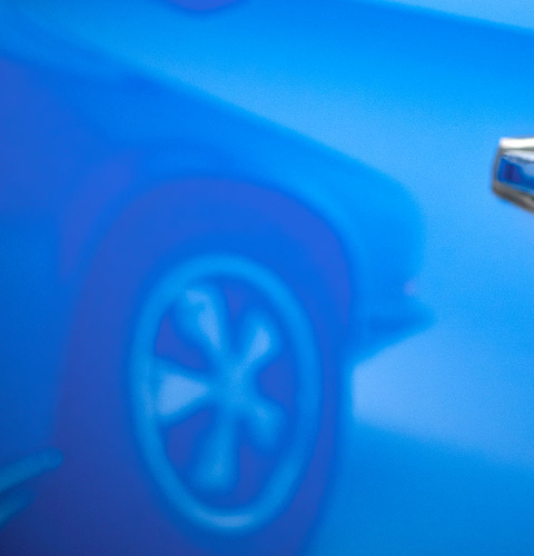 Spiegelung von original Porschefelge 911 im blauen Lack